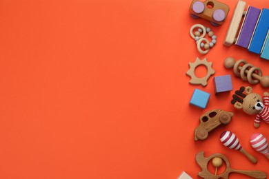 Photo of Different children's toys on orange background, flat lay. Space for text