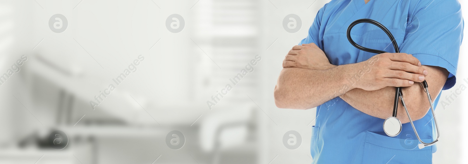 Image of Medical assistant with stethoscope in hospital, space for text. Health care worker