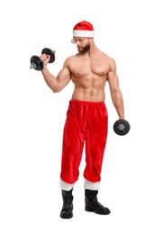 Attractive young man with muscular body in Santa hat holding dumbbells on white background
