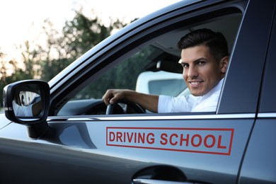 Driving school instructor in modern car, view from outside