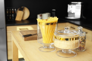 Photo of Products on wooden table in modern kitchen