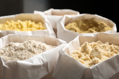Photo of Different types of flour in paper bags