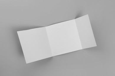 Photo of Blank paper brochure on light grey background, top view. Mockup for design