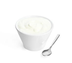 Photo of Tasty organic yogurt in bowl and spoon isolated on white