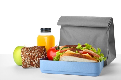 Lunch box with healthy food for schoolchild on white background