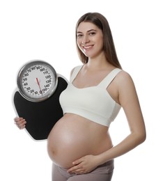 Photo of Pregnant woman with scales on white background