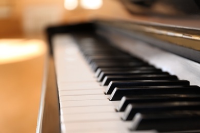 Black and white piano keys indoors, closeup