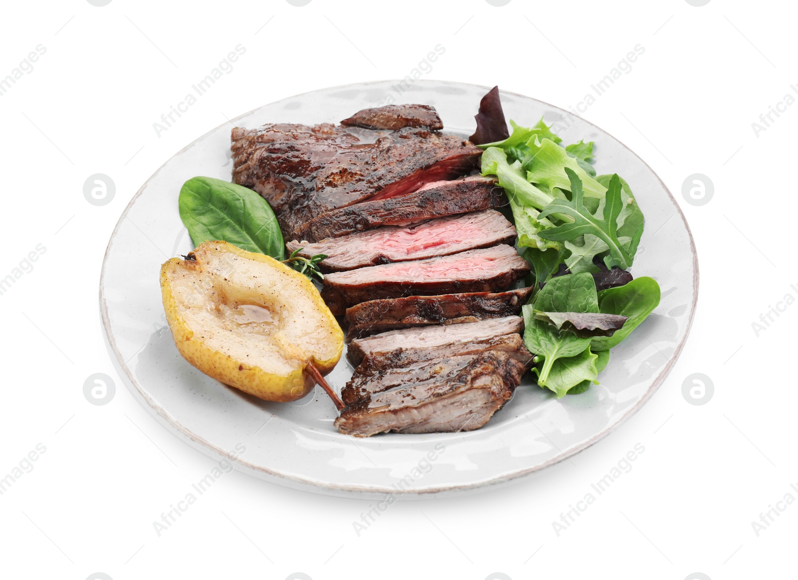 Photo of Pieces of delicious roasted beef meat, caramelized pear and greens isolated on white