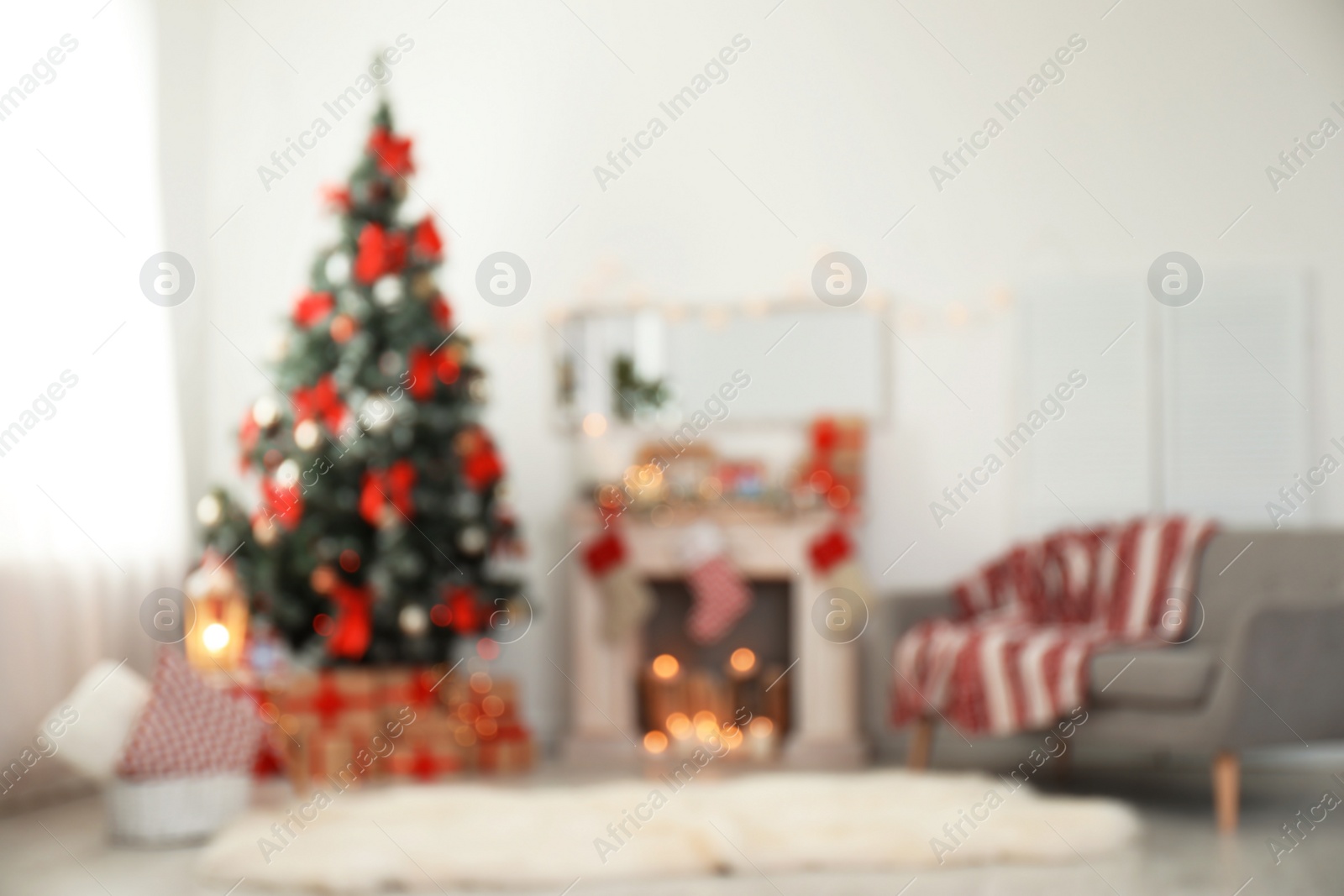 Photo of Blurred view of stylish living room interior with decorated Christmas tree