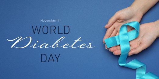 World Diabetes Day. Woman holding light blue ribbon on color background, top view. Banner design