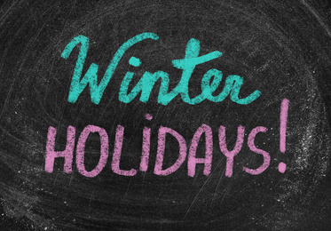 Image of Text Winter Holidays on school chalkboard as background