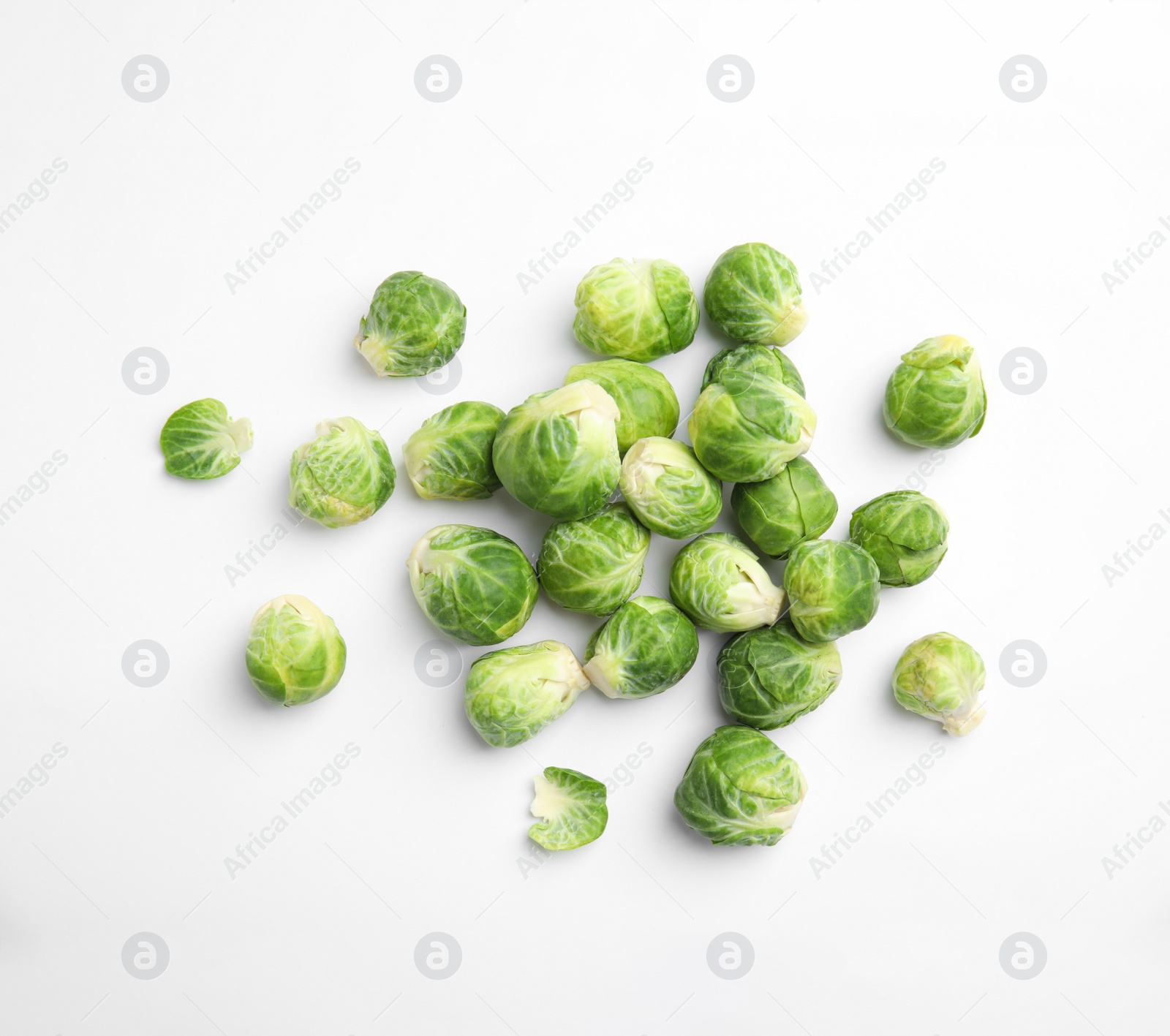 Photo of Fresh Brussels sprouts on white background, top view