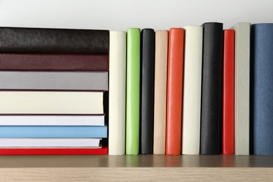 Bunch of different books on wooden table