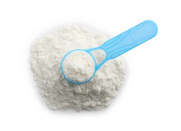 Photo of Powdered infant formula and scoop on white background, top view. Baby milk