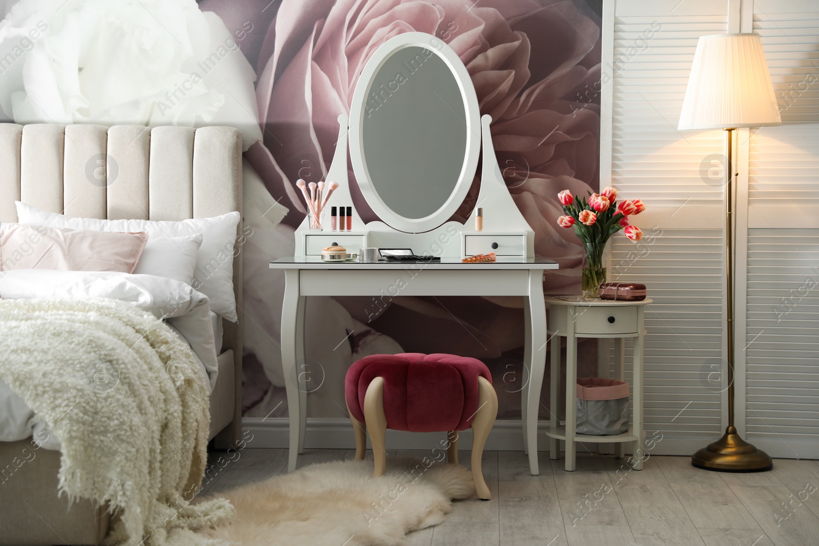 Photo of Stylish bedroom interior with elegant dressing table and floral wallpaper