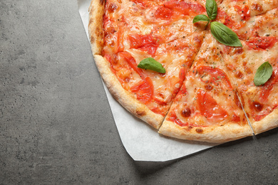 Delicious pizza Margherita on grey table, top view