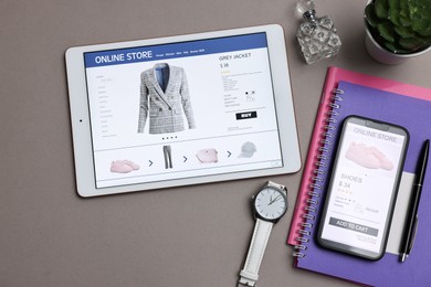 Photo of Online shopping. Flat lay composition with modern tablet and smartphone on grey background