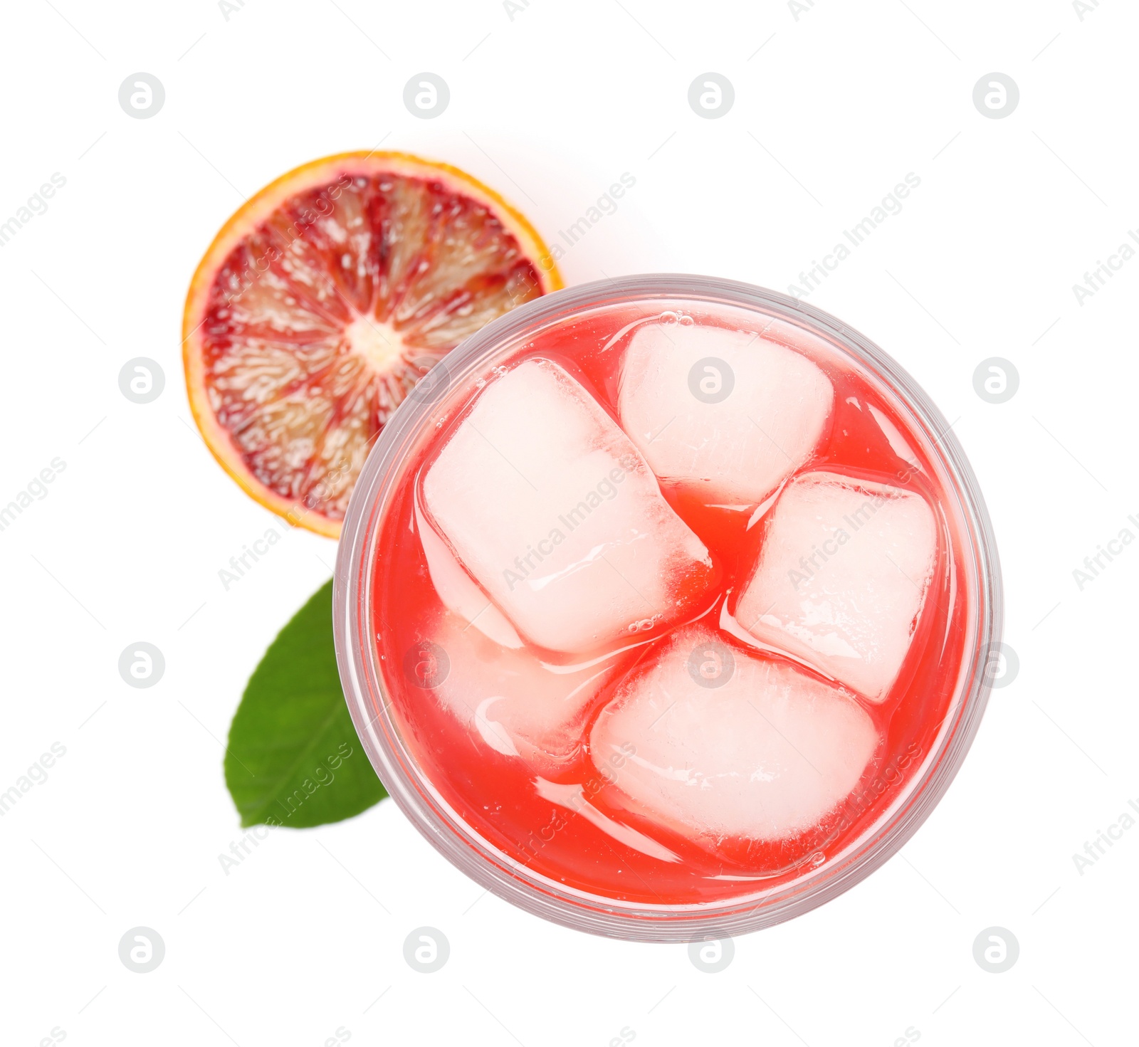 Photo of Tasty sicilian orange juice with ice cubes in glass, fruit and leaf on white background, top view