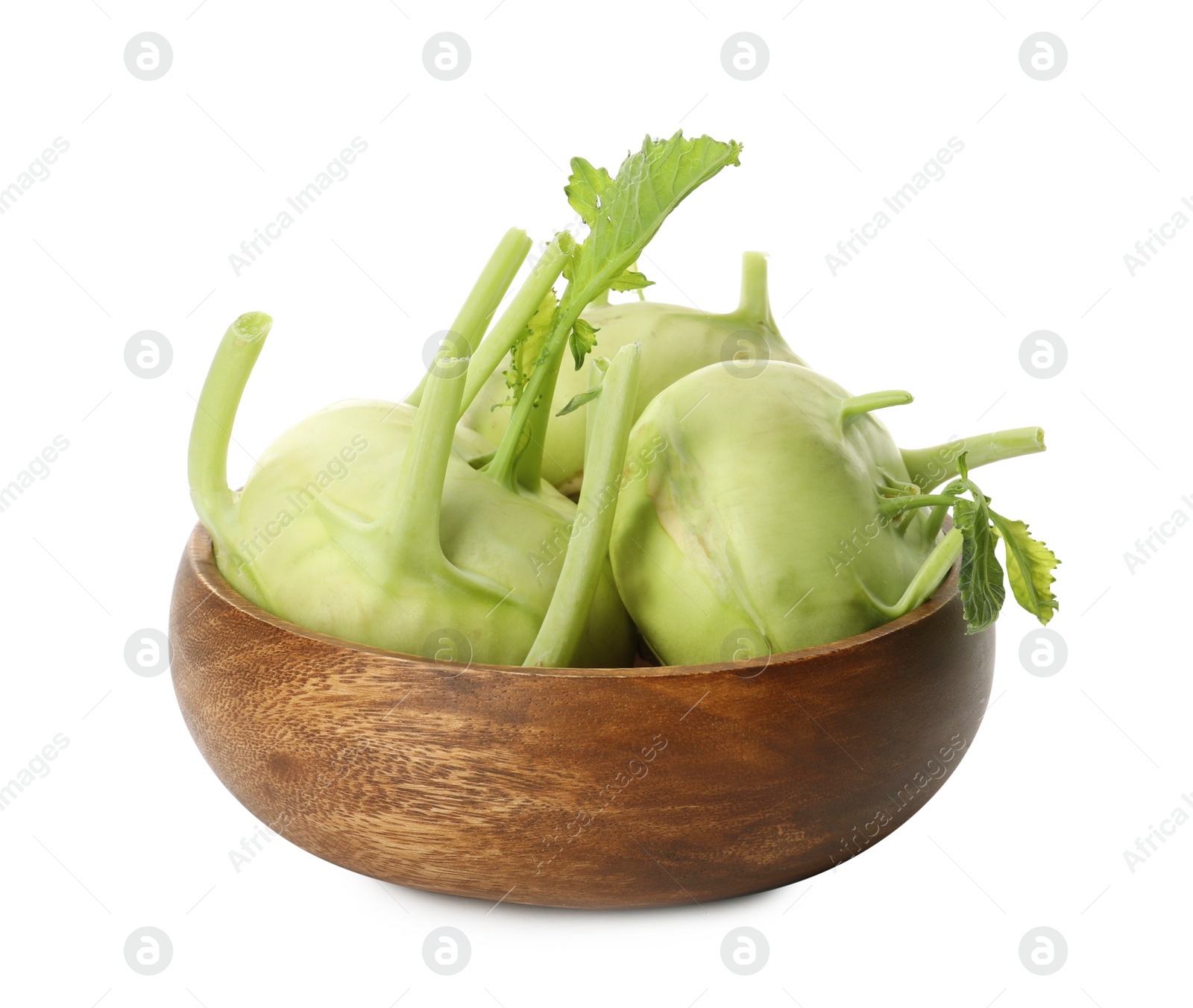 Photo of Whole ripe kohlrabi plants in wooden bowl on white background