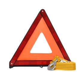 Photo of Emergency warning triangle and towing strap on white background. Car safety