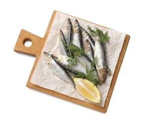 Photo of Fresh raw sprats, dill and cut lemon isolated on white, top view