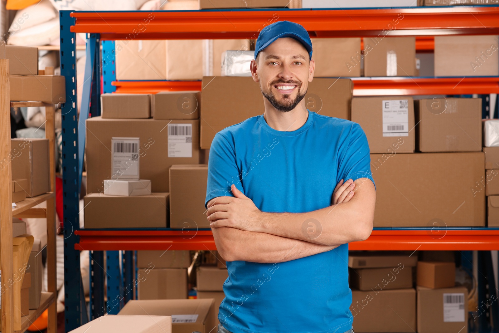 Photo of Post office worker near rack with parcels indoors, space for text