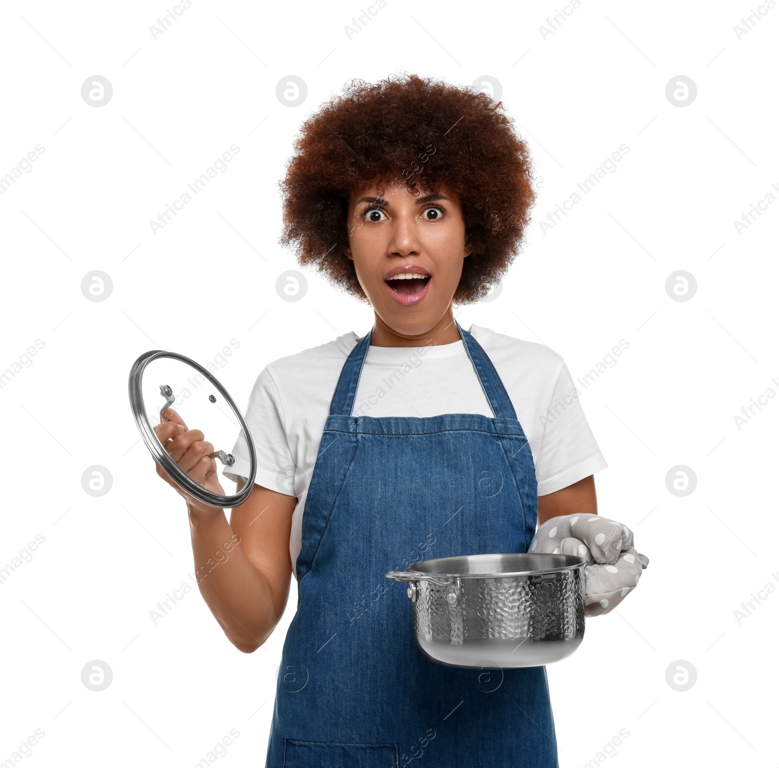 Photo of Emotional young woman in apron holding cooking pot on white background