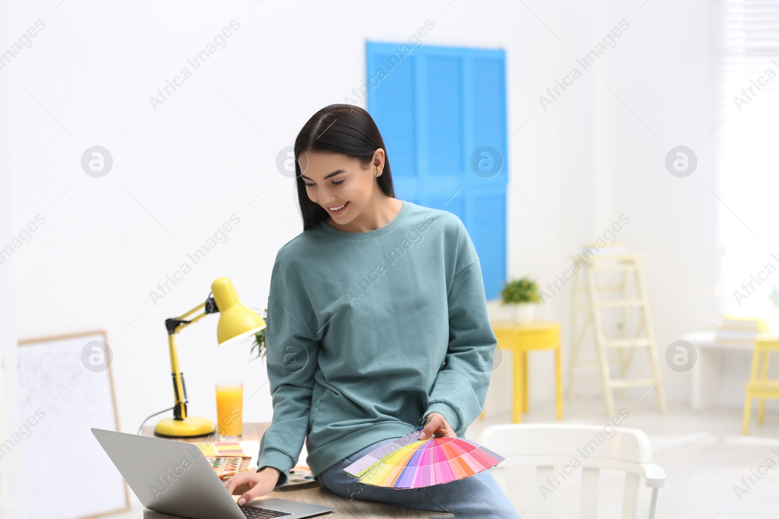 Photo of Female designer working in office. Creative profession