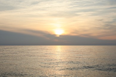 Photo of Picturesque view of sea at sunset. Tropical beach