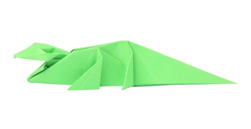 Photo of Origami art. Handmade green paper crocodile on white background