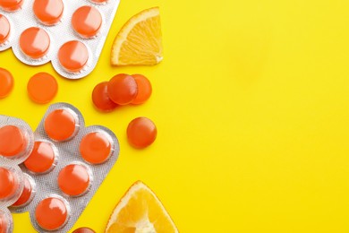 Photo of Many orange cough drops on pink background, flat lay. Space for text