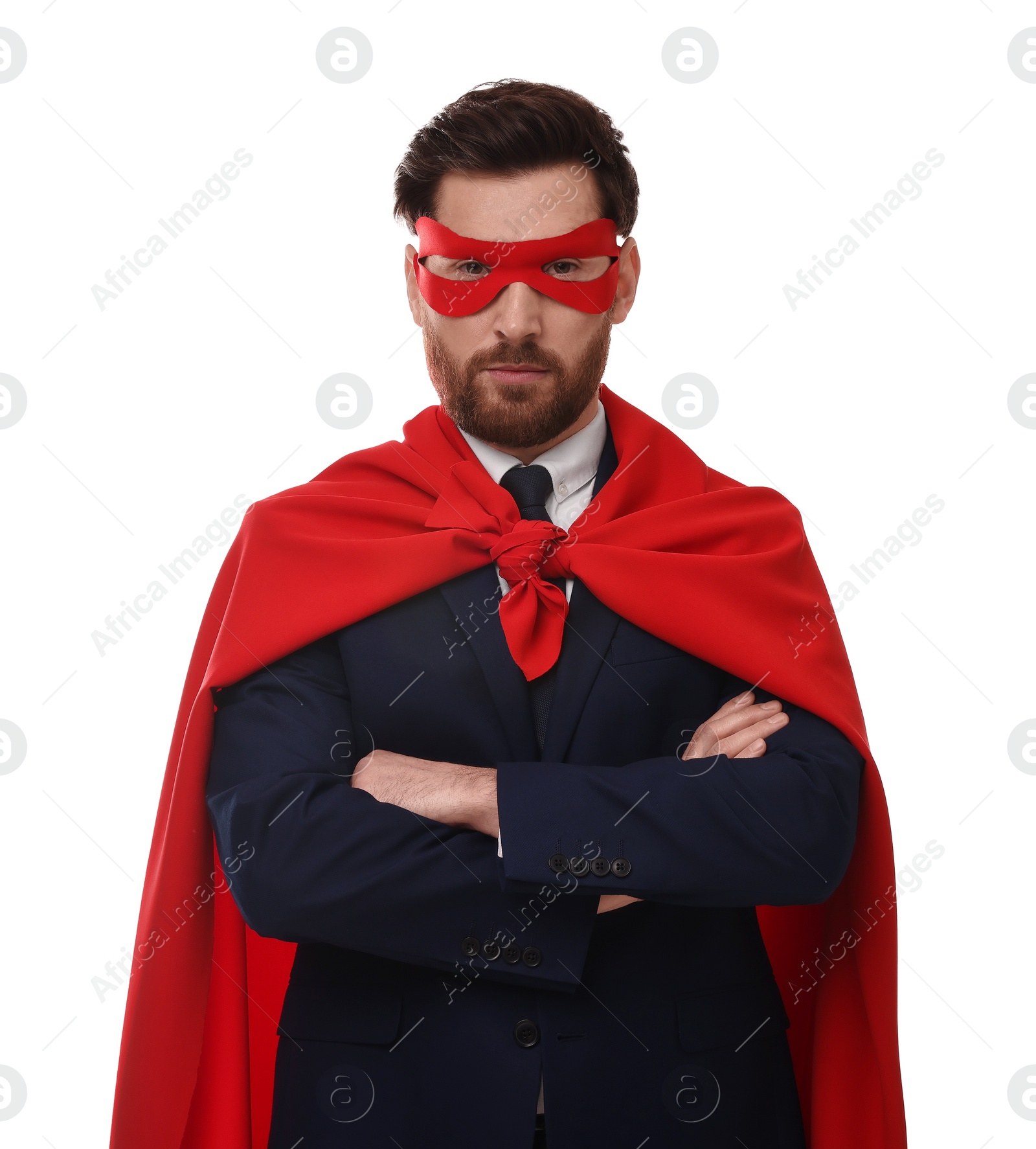 Photo of Confident businessman wearing red superhero cape and mask on white background