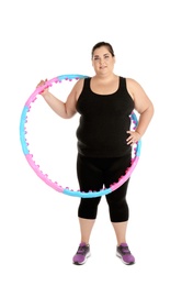 Photo of Overweight woman with hula hoop on white background