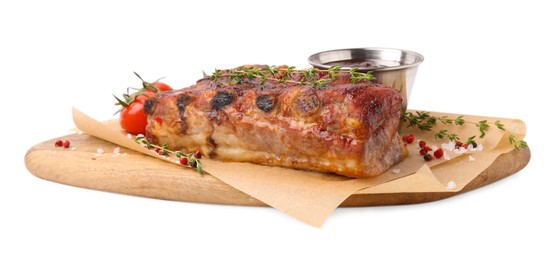 Tasty roasted pork ribs, thyme, sauce and tomatoes isolated on white