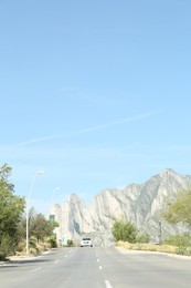 Photo of Beautiful view of asphalt road near trees in mountains