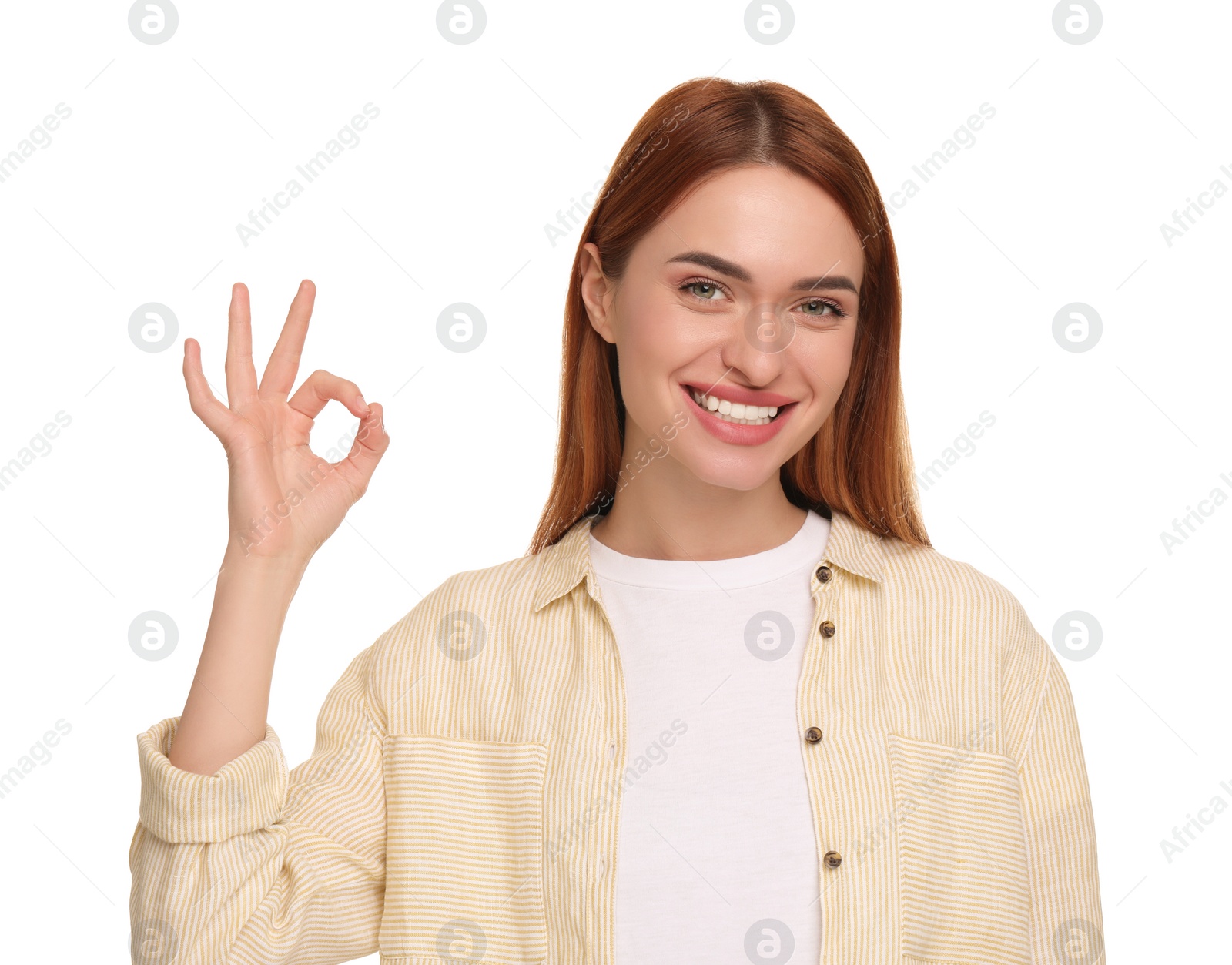 Photo of Beautiful woman with clean teeth showing ok gesture on white background