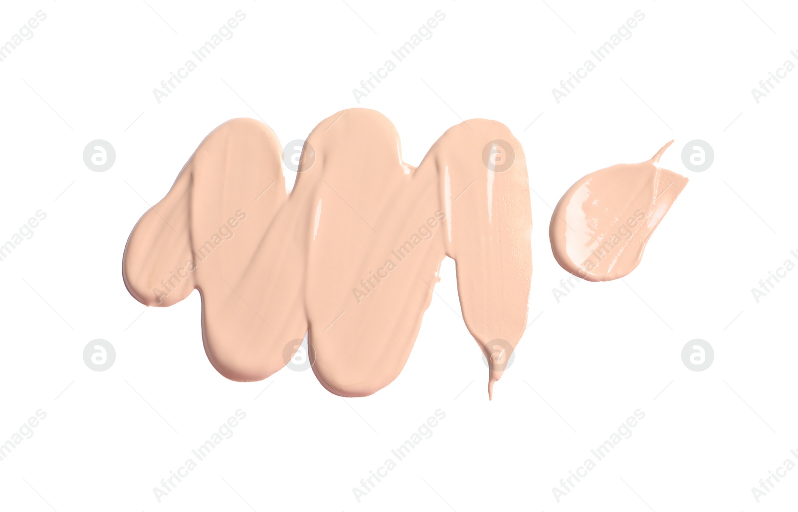 Photo of Smears of skin foundation isolated on white, top view
