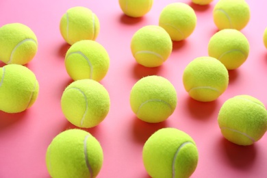Photo of Tennis balls on pink background. Sports equipment