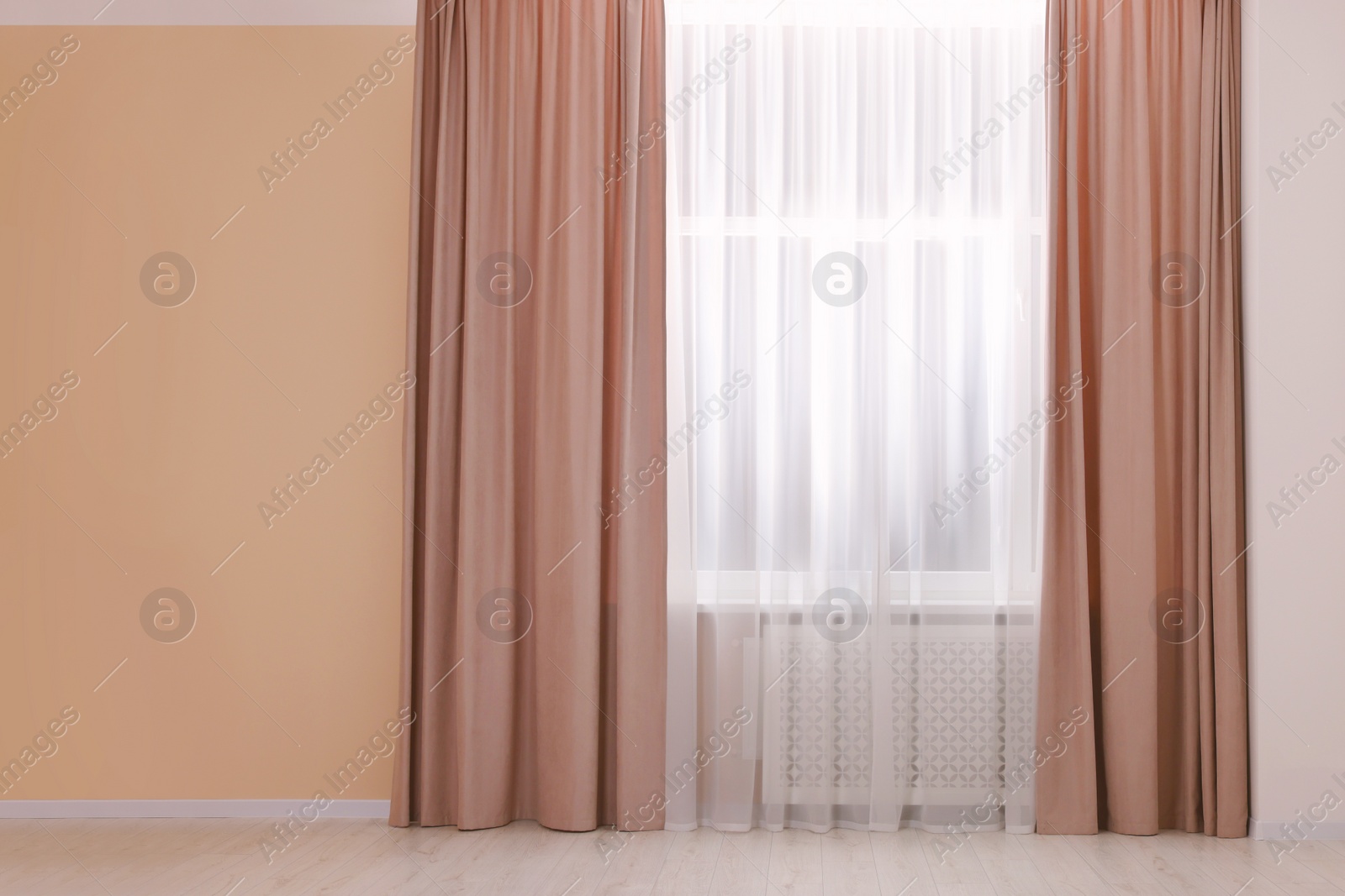 Photo of Window with beautiful curtains in room. Interior design