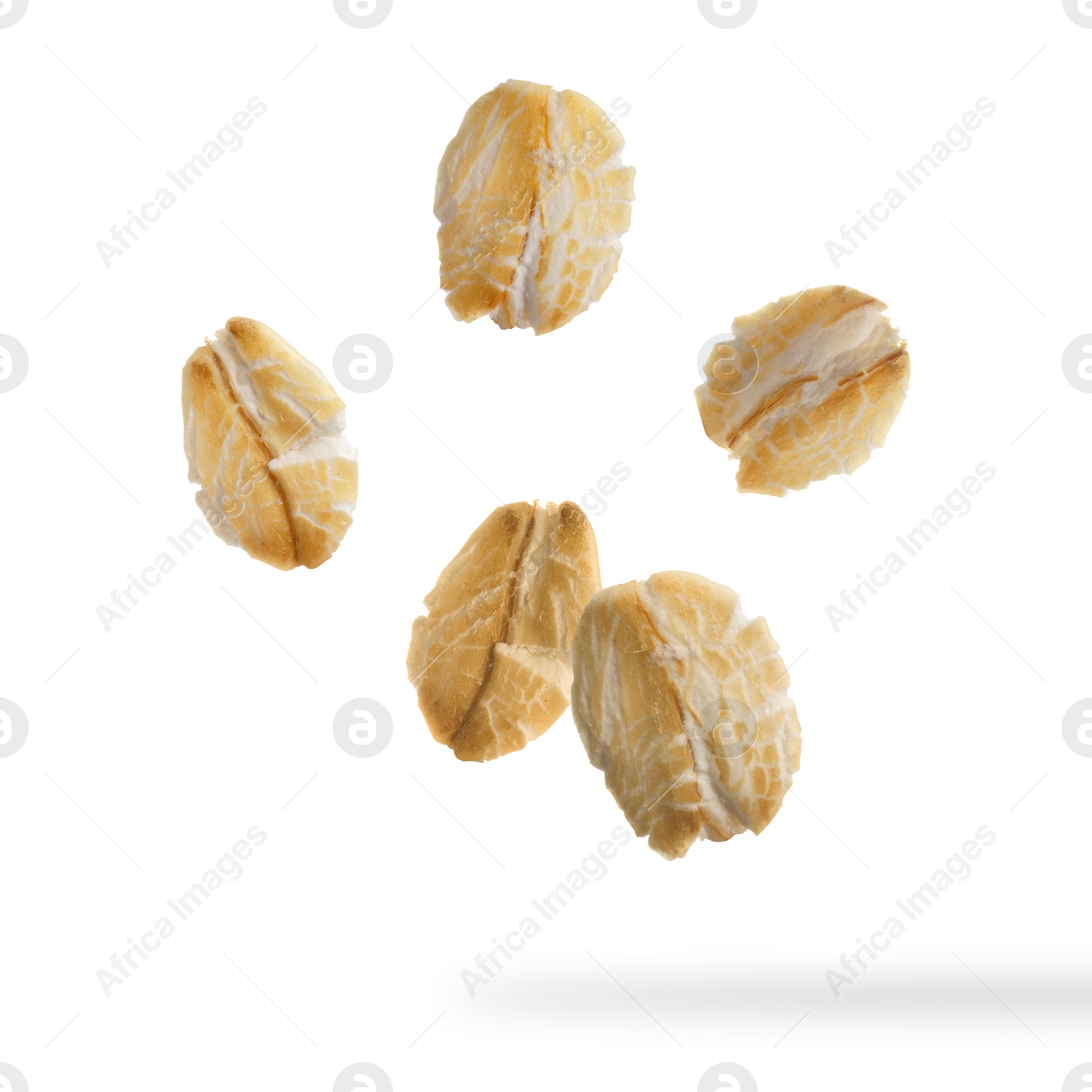 Image of Rolled oat flakes falling on white background