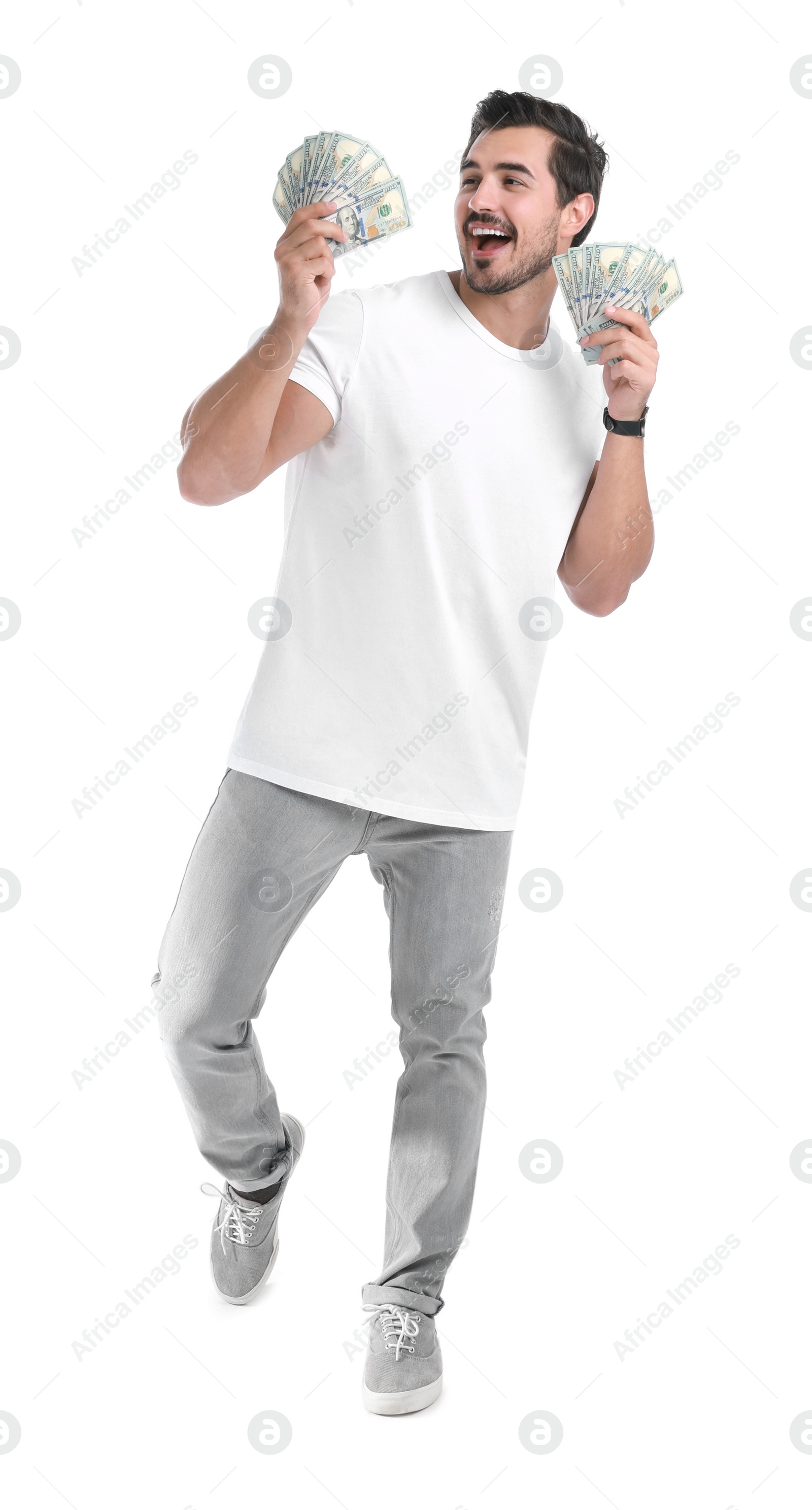 Photo of Handsome young man with dollars on white background