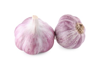 Photo of Fresh raw garlic heads isolated on white