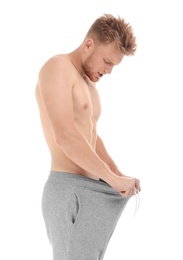 Photo of Young man with urological problems on white background