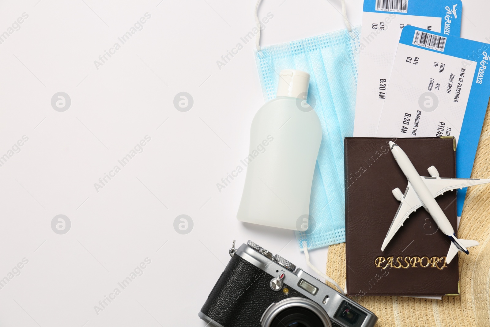 Photo of Composition with passport and protective mask on white background, top view. Travel during quarantine