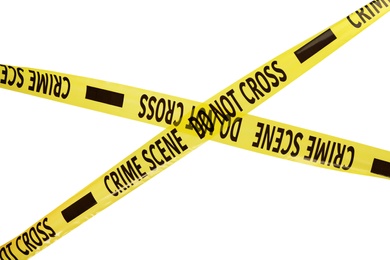 Photo of Yellow crime scene tapes isolated on white