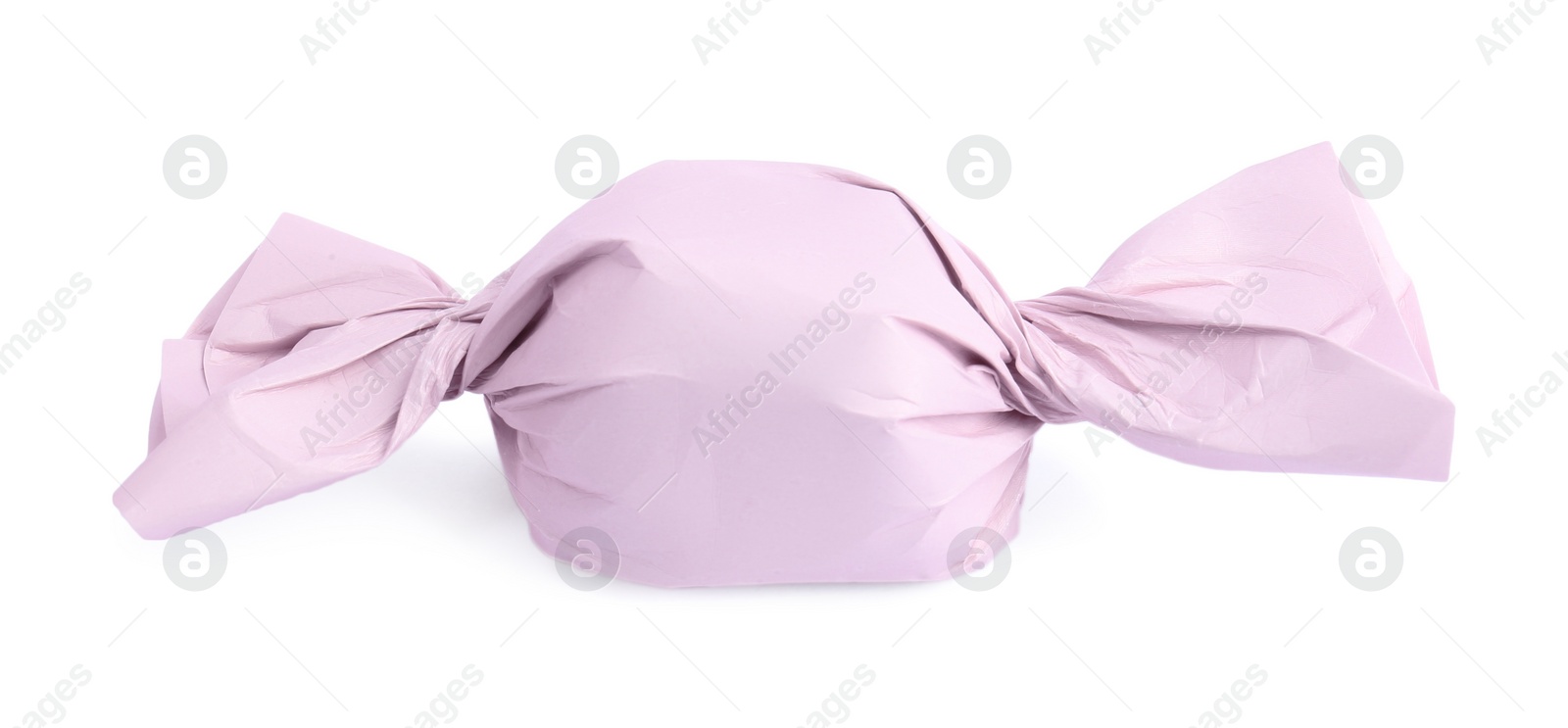 Photo of Tasty candy in pink wrapper isolated on white