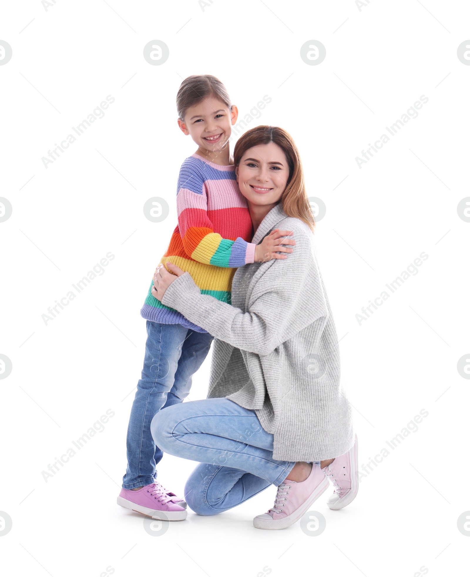 Photo of Happy woman and daughter in stylish clothes on white background