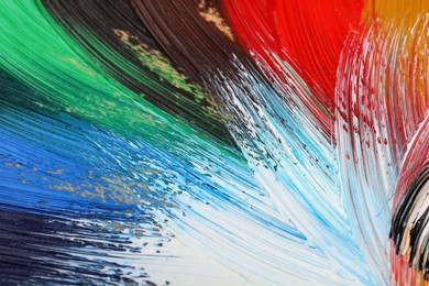 Photo of Abstract colorful acrylic paint as background, top view