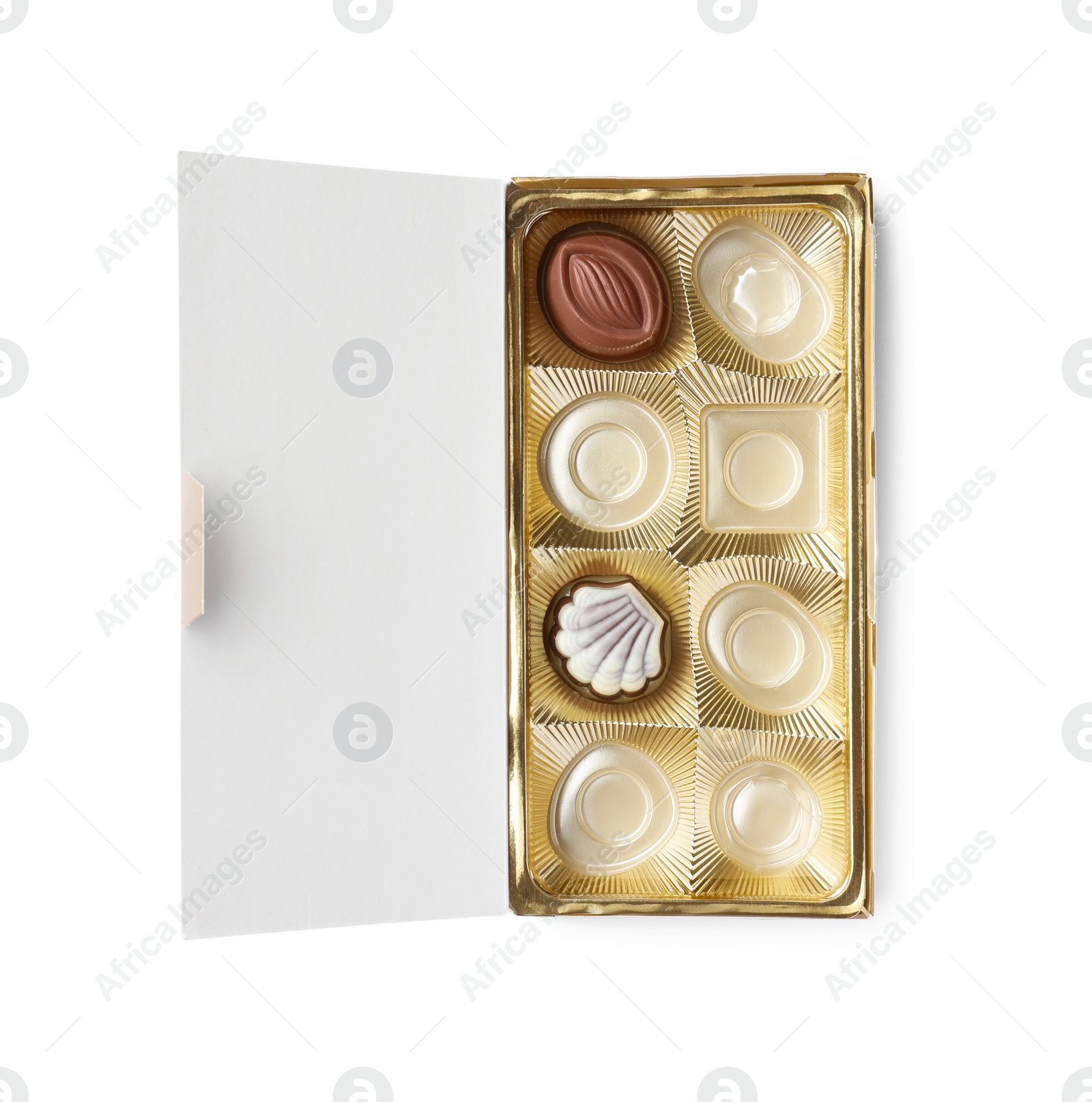 Photo of Partially empty box of chocolate candies isolated on white, top view