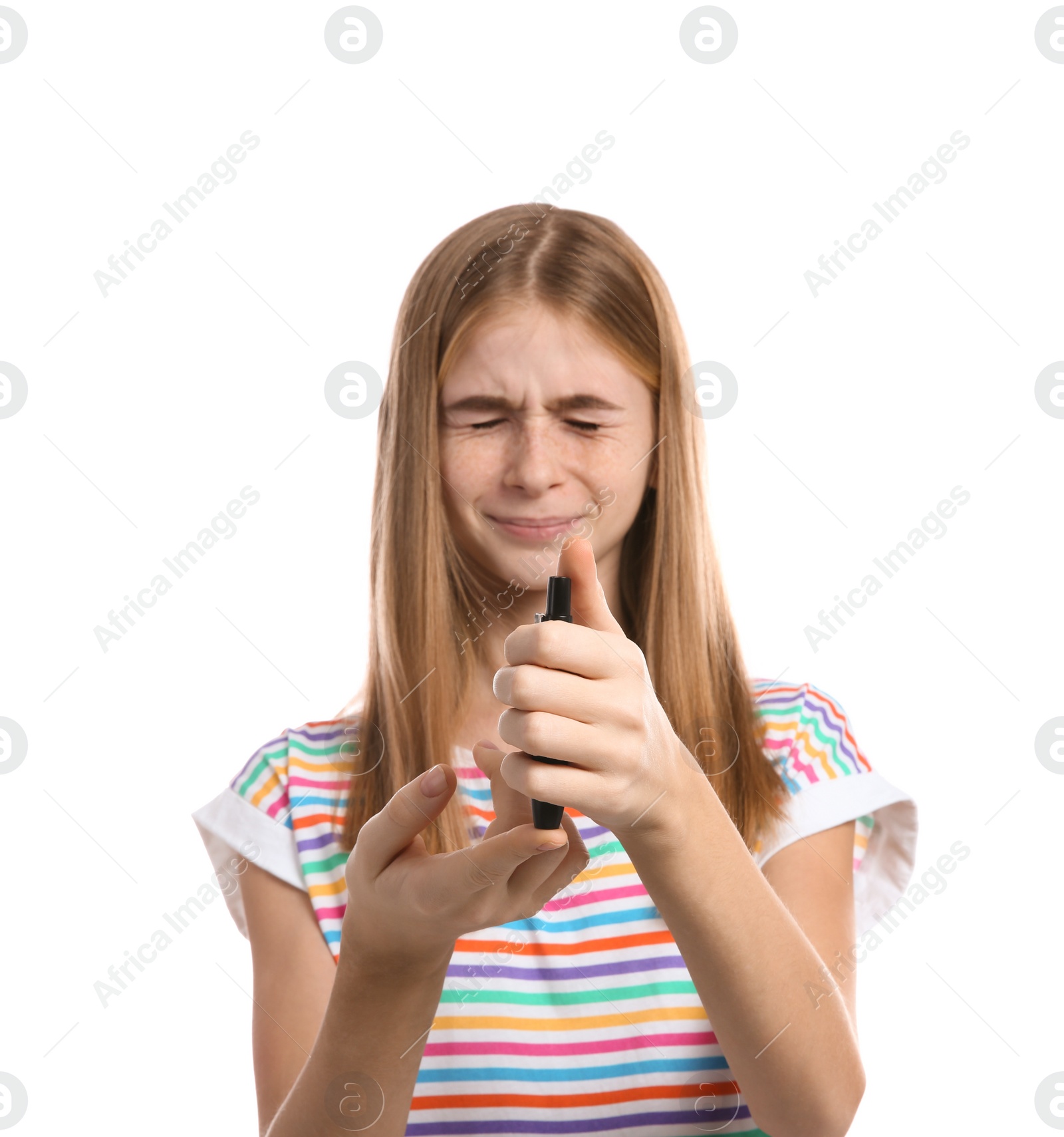 Photo of Teen girl using lancet pen on white background. Diabetes control